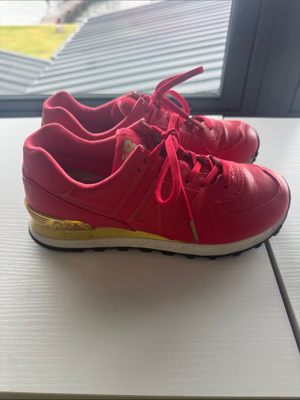 New Balance Pink Sneakers with Gold Heel Accent